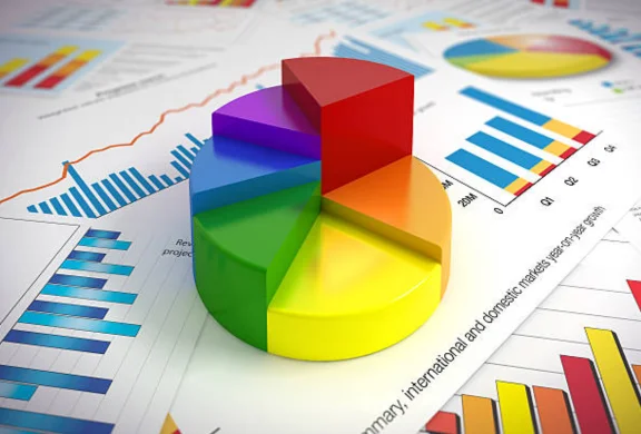  A colorful pie chart symbolizing information management & data analysis sitting on a pile of documents